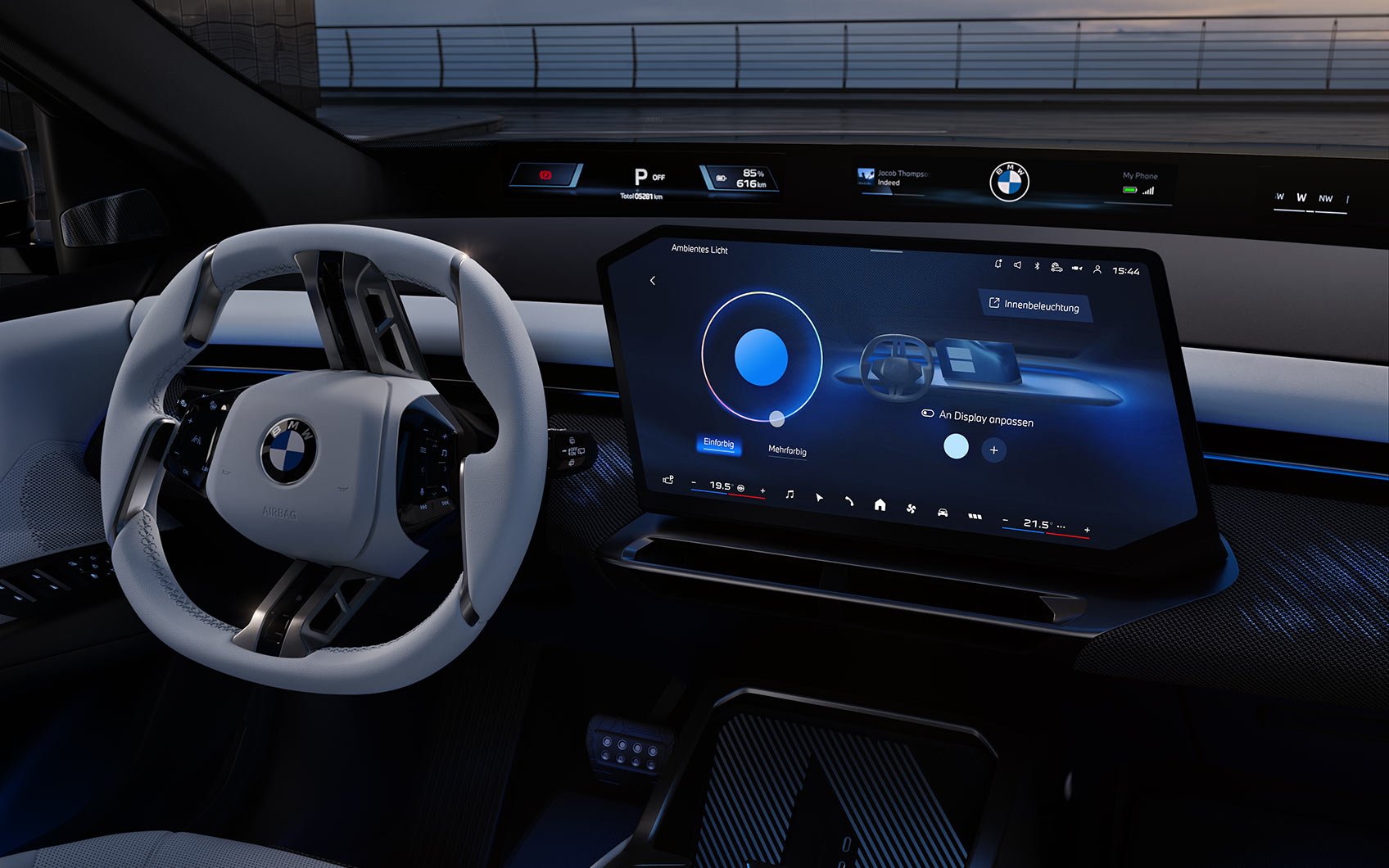 Digitales Cockpit eines BMW iX3 mit großem Touchdisplay und weißem Lenkrad.