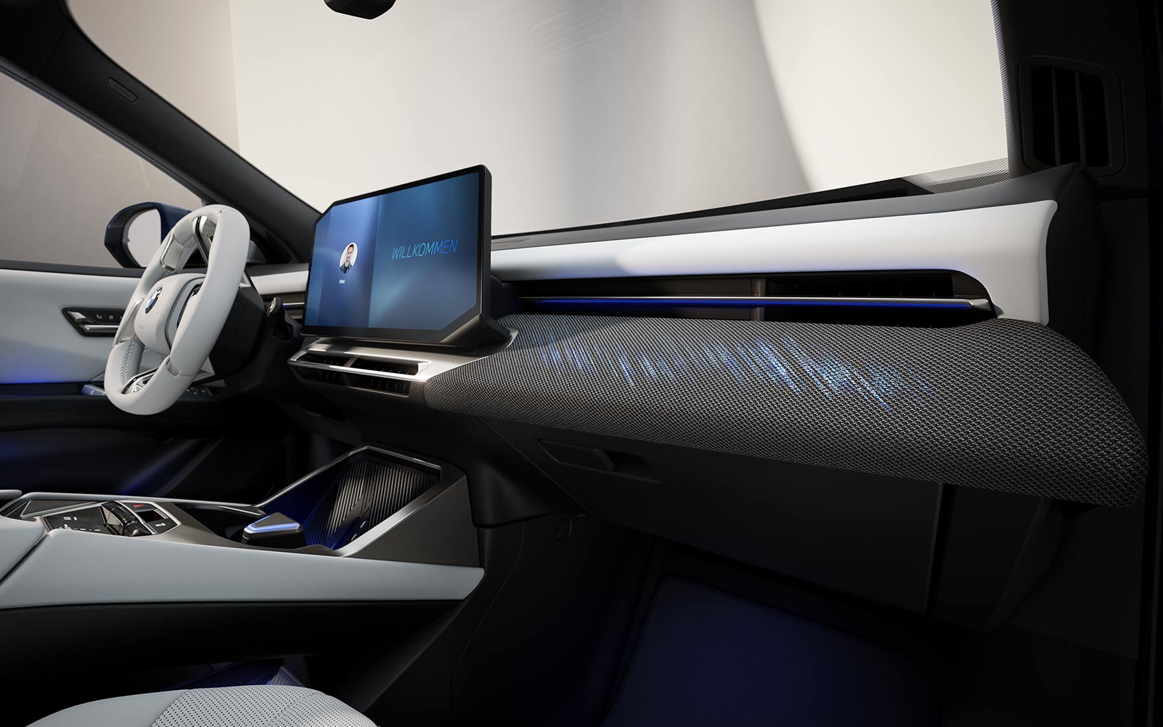 BMW iX3 Innenraum mit Display, Mittelkonsole und beleuchtetem Armaturenbrett.